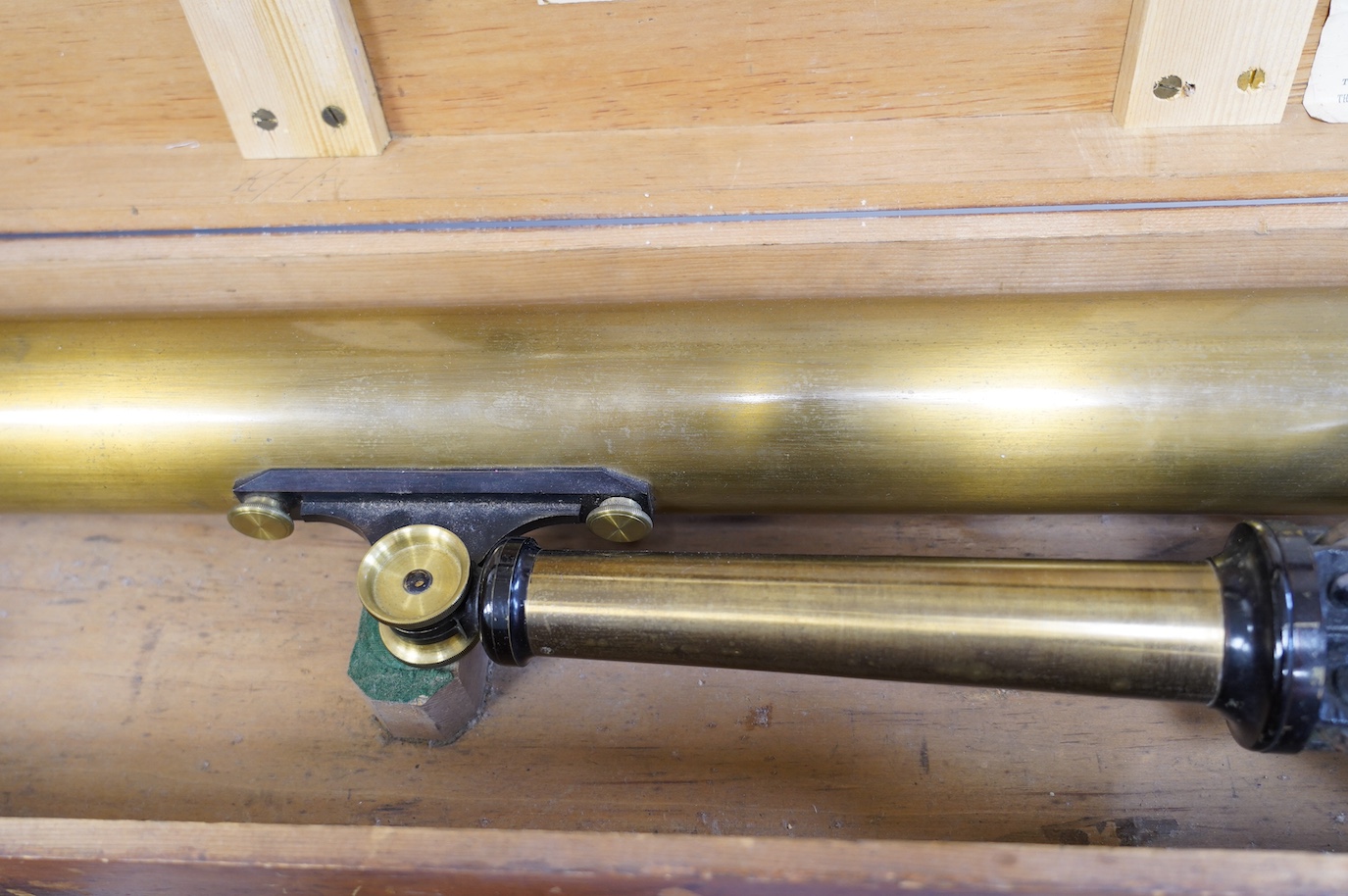 A 19th century brass telescope by Yeates & Son, Dublin, with integral brass and cast iron stand, in a pine case with labels to the inside of the lid, case 102cm long, 23cm deep, 13.5cm high. Condition - fair, splits to t